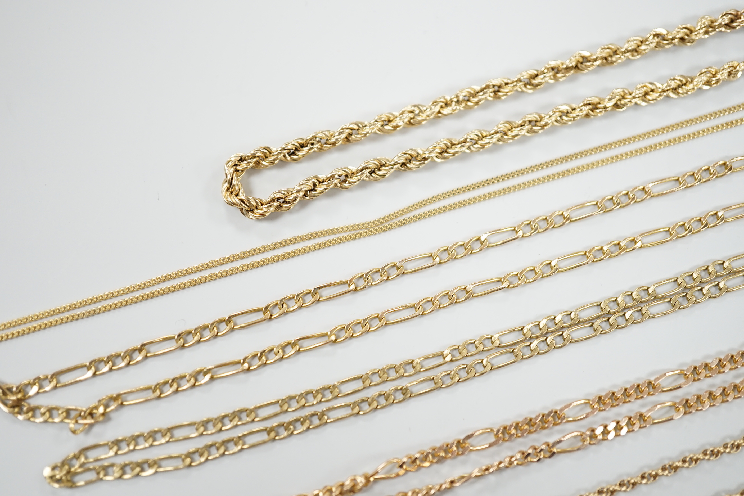 Six assorted modern 9ct gold chains, longest 54cm and a 9ct gold rope twist bracelet, 18cm, 18.5 grams.